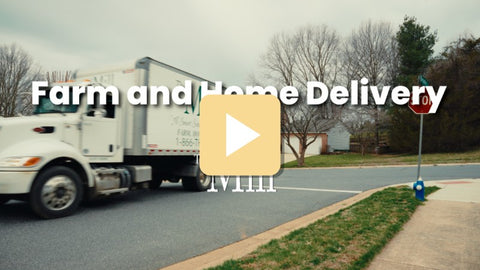 A white semi-truck is driving on a suburban road under an overcast sky, with large overlaid text reading 'Farm and Home Delivery' and a yellow play icon in the center.