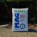 Mag Ice Melting Flakes by Innovative Surface Solutions, magnesium chloride de-icer in clear plastic bag with label, ready for ice melting.