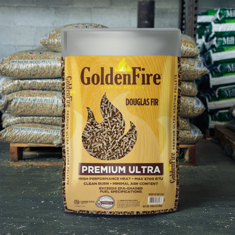 Bag of Golden Fire premium wood heat pellets with a pallet of pellets behind it