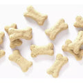 Cute puppy with Bradley Caldwell Inc. Wholesomes Rewards Puppy Original Biscuits in a 2 lb bag, showing the dog treats.