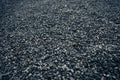 Close-up of dark asphalt surface