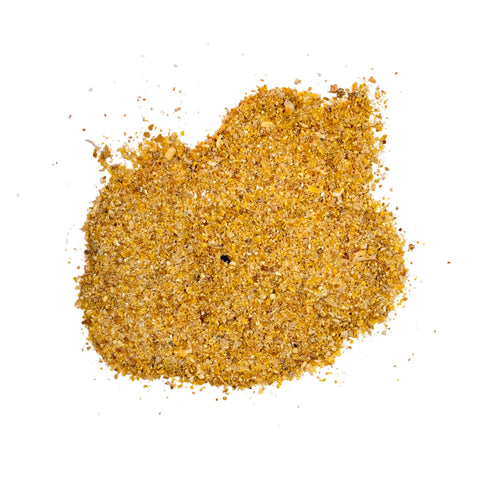 Farmers feeding young chickens with The Mill non-medicated starter chicken feed in a farm setting.