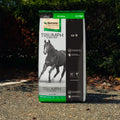 Nutrena Triumph 12-8 horse feed pellet bag showing the product label and packaging for horse nutrition.