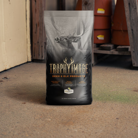 Trophy Image Deer and Elk Products sitting in front of garden pots 