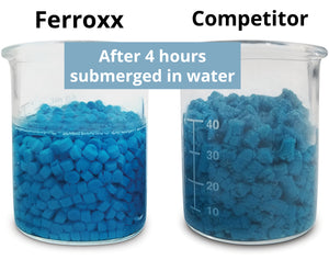 Beaker of Ferrox slug pellets in water comparison with competitor product